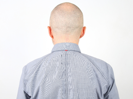 portrait of a bald man from the back