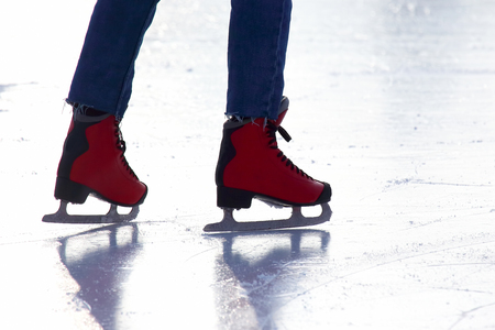 Feet skating on the ice rinkの写真素材