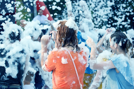 man in a soapy foam at the festival discoの写真素材
