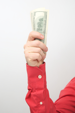 Hand with outstretched money bills. Financial operations. Business relationshipの写真素材