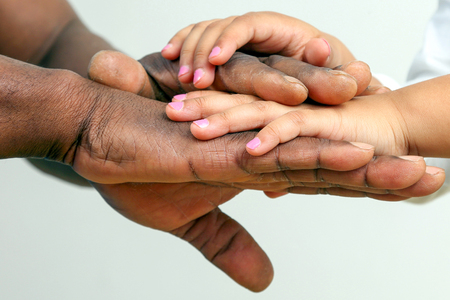 the hands of the father and child together closeup. Parent-child relationship. Intimacy and trust.の写真素材