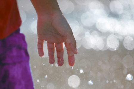 wet a man's hand on blurred background. leisure and relaxationの写真素材
