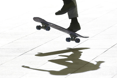 jump a young man on a skateboard. entertainment and leisure. sports and Hobbies of teenagersの写真素材