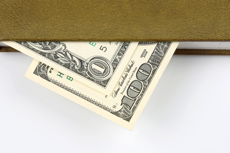 dollar bills lie within your notebook. Finance and educationの写真素材