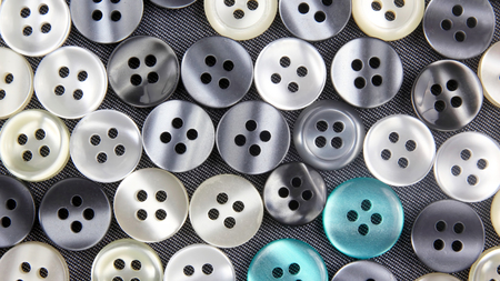 different mother of pearl buttons on fabric