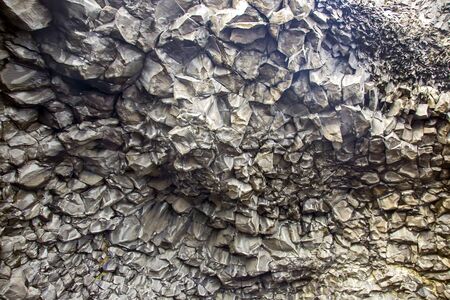 Basalt columns on a black beach in Iceland