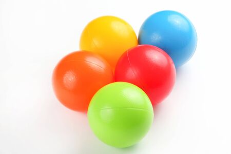 Colored plastic balls on white backgroundの写真素材