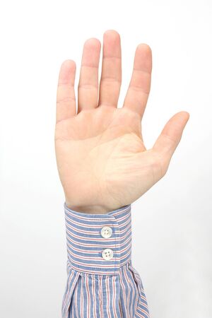 Male hand with raised fingers on a white background
の写真素材