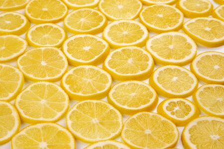 sliced citrus lemons half on a light backgroundの写真素材