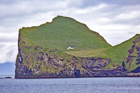 Lonely house on the Island of the Vestmannaeyjar archipelago. Icelandの写真素材