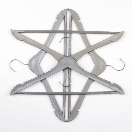 gray clothes hanger on a white background. The choice of style of fashionable clothesの写真素材