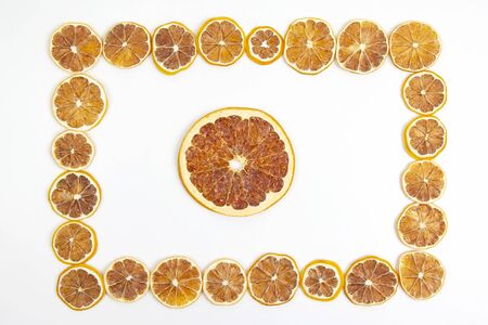 frame of dried lemon slices on a white background. vitamin fruit foodの写真素材