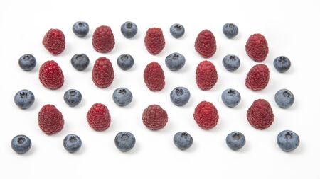 raspberry and blueberry on a white background. Vitamins and wholesome foodsの写真素材