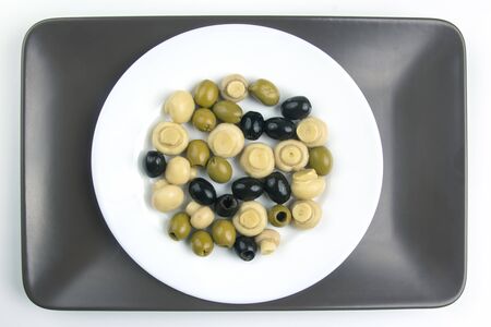 salad of black and green olives on a plate. food and vegetables. diet and weight lossの写真素材