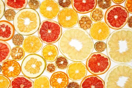 mix of different pieces of dried citrus fruit on white background

の写真素材