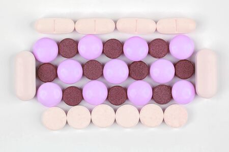 different medicinal pills on white background