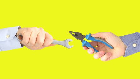 Hands with different working tools. Industry and industrial enterprises. Working profession.