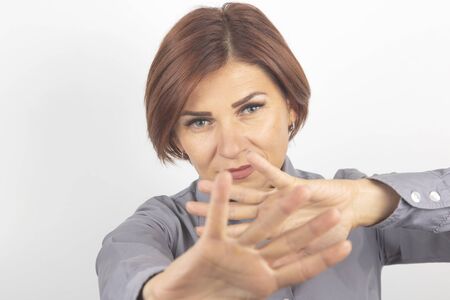 beautiful girl protests with the help of her hands her protest and emotions of denialの写真素材