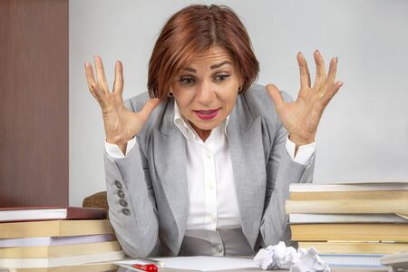 Business woman tired in the office and worried in emotions. Stress and headache