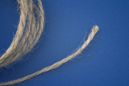 rope made of natural material on a blue backgroundの写真素材