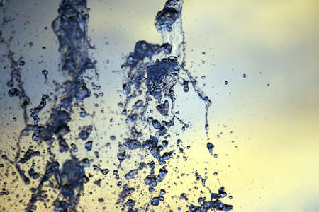 abstract figure of a water fountain on blurred backgroundの写真素材