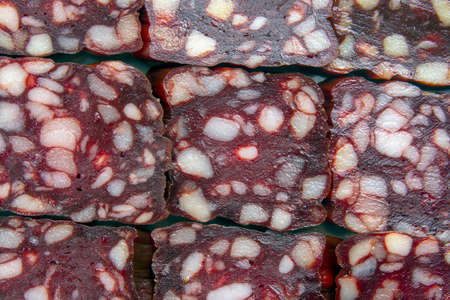 sliced ââparts of sausage, salami close-up. fast food and breakfastの写真素材