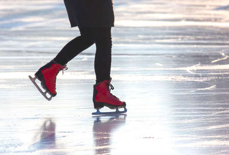 girl ice skating on an ice rink. hobbies and leisure. winter sportsの写真素材