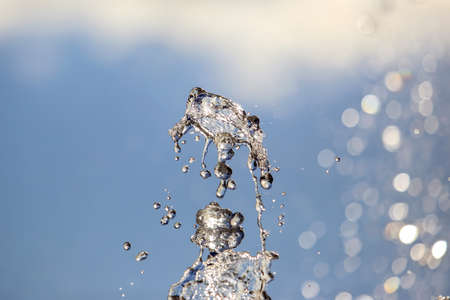 abstract figure of a water fountain on blurred backgroundの写真素材