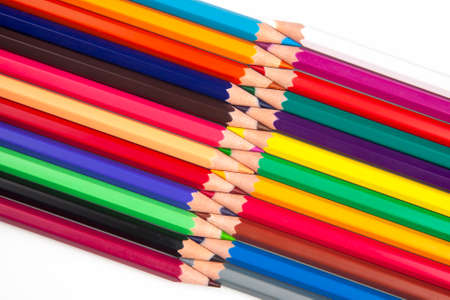 Colored pencils for drawing on a white background. Education and creativity. Leisure and art