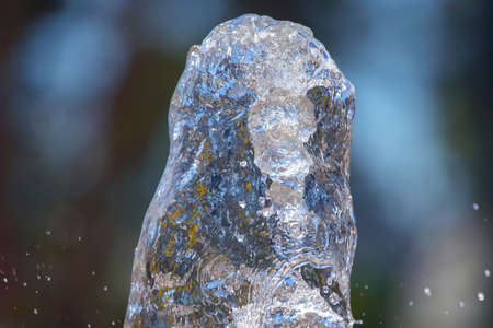 abstract figure of a water fountain on blurred background