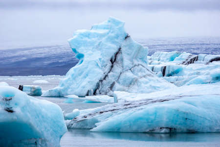 Blue Ice on the shore of the ice lagoon in Iceland