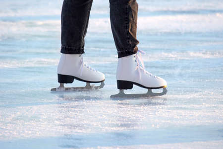 legs of a girl ice skating on an ice rink. hobbies and leisure. winter sportsの写真素材