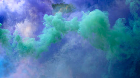 Colored creeping smoke. Blurred background.の写真素材