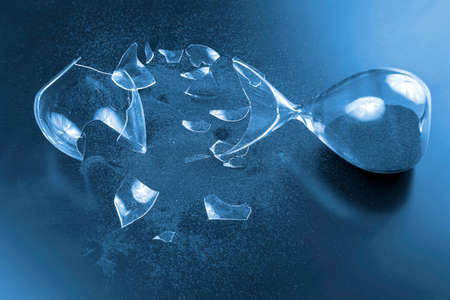 broken hourglass. waste of time. end of opportunity. stop measuring hours. shards of glass....