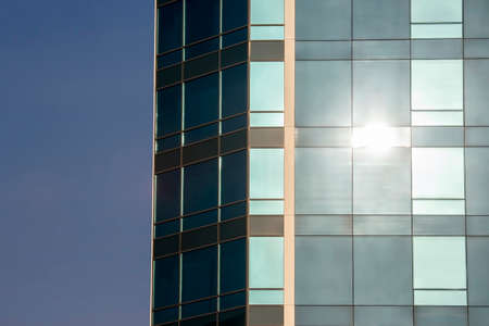 transparent facade of the building against the sky