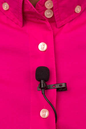 small condenser audio microphone for voice recording attached with a clothespin to your shirtの写真素材