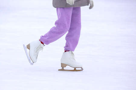 ice skating woman legs on ice rink. hobbies and winter sportsの写真素材