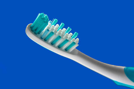 toothbrush close-up on a blue background. oral hygieneの写真素材