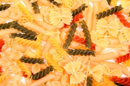 different types of italian pasta on a white background. flour products and food in cooking
