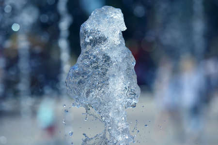 abstract figure of a water fountain on blurred backgroundの写真素材