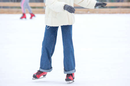 ice skating woman legs on ice rink. hobbies and winter sportsの写真素材