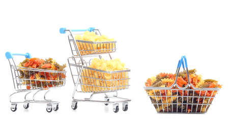 different types of italian pasta in a grocery basket from the market on a white background. flour products and food in cookingの写真素材
