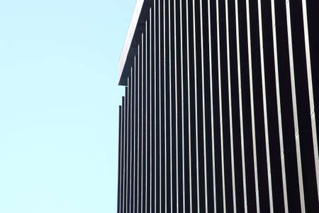 transparent facade of the building against the skyの写真素材