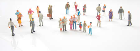 miniature people. different people stand on a white background. communication of society of different generationsの写真素材