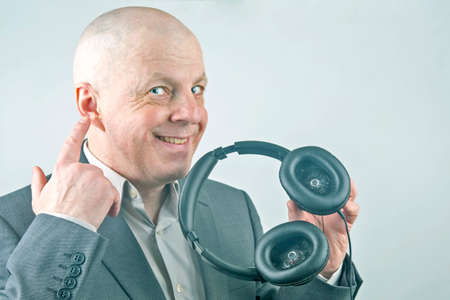 business man advertises headphones for listening to music.