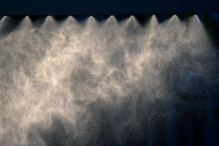the spray of the fountain on blurred backgroundの写真素材