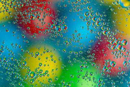 colored drops of water on glass. abstract background texture