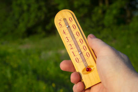 thermometer showing air temperature during hot summer seasonの写真素材