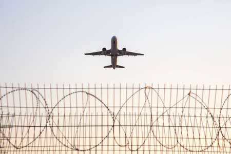 Passenger jet plane flies in the sky. Air transport industryの写真素材