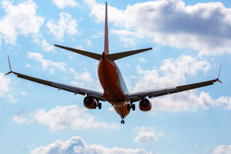 Passenger aircraft landing approach to the airport. Airplane flight in the sky.の写真素材